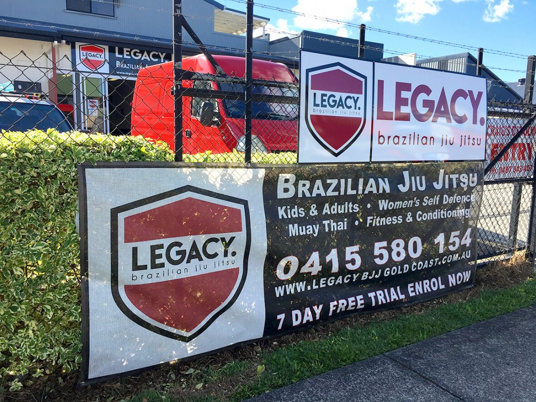 banners-stickers-wrap-business-gold coast-currumbin-fence mesh-stick it sign